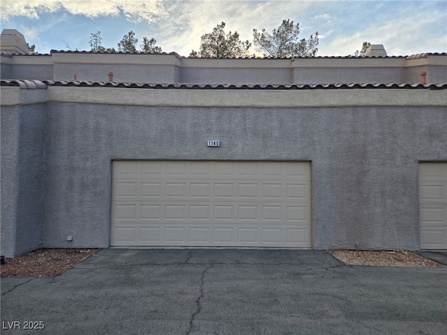 garage featuring driveway