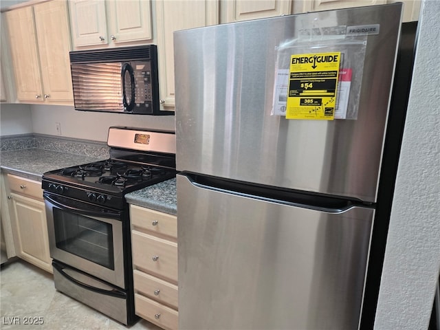 kitchen with stainless steel appliances and dark countertops