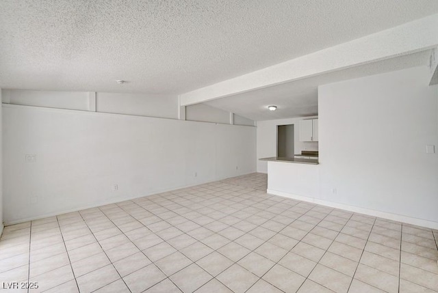unfurnished room featuring a textured ceiling