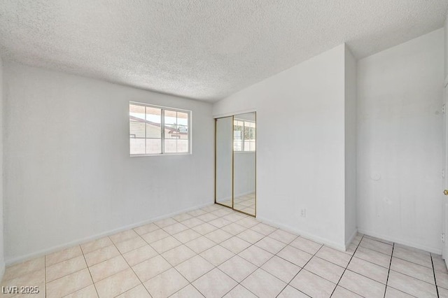empty room with a textured ceiling