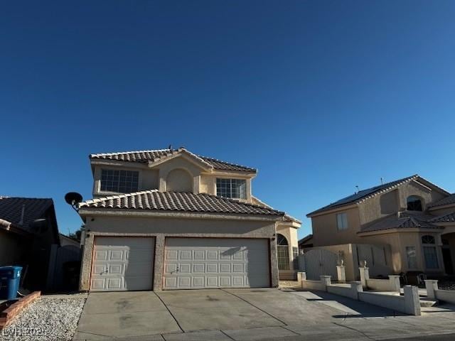 529 Rancho Del Mar Way N, Las Vegas, NV 89031 - view of front of property with driveway, a tile roof, stucco siding, and a garage