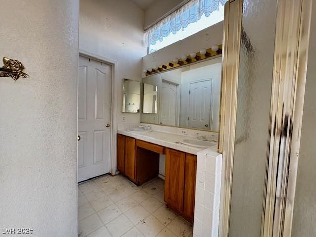 529 Rancho Del Mar Way N, Las Vegas, NV 89031 - bathroom with tile patterned floors, double vanity, and a textured wall