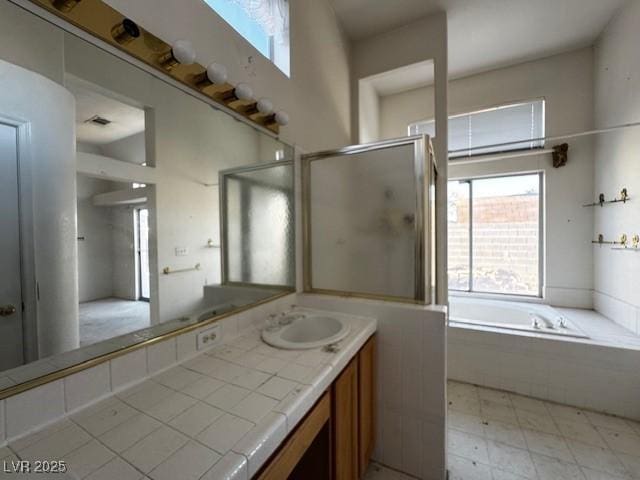 529 Rancho Del Mar Way N, Las Vegas, NV 89031 - full bath featuring a garden tub, vanity, and a shower with door