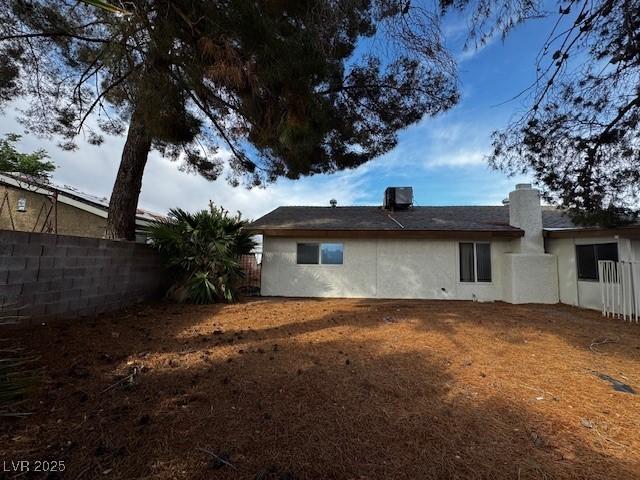 1126 Azul Way, Boulder City, NV 89005 - back of house featuring a fenced backyard, stucco siding, and a chimney