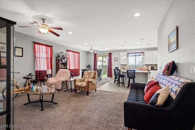 3708 Fuselier Dr, North Las Vegas, NV 89032 - living area featuring ceiling fan, light carpet, and recessed lighting