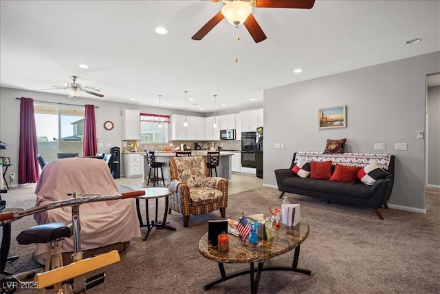 3708 Fuselier Dr, North Las Vegas, NV 89032 - living room with ceiling fan, recessed lighting, baseboards, and light carpet