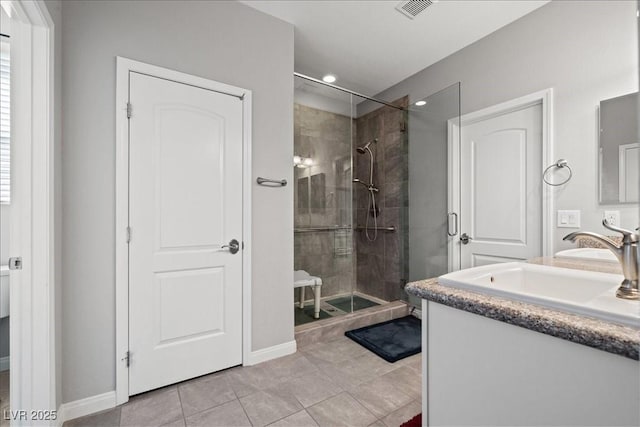 3708 Fuselier Dr, North Las Vegas, NV 89032 - full bath featuring a stall shower, tile patterned flooring, vanity, recessed lighting, and baseboards