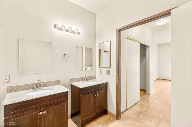 4830 Grey Wolf Ln Unit 104, Las Vegas, NV 89149 - bathroom with two vanities and tile patterned floors