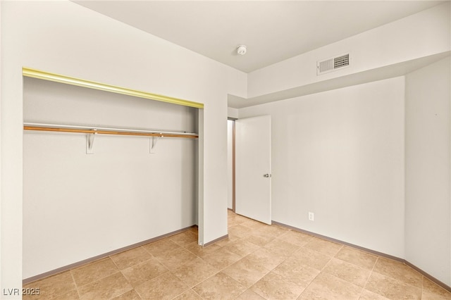 4830 Grey Wolf Ln Unit 104, Las Vegas, NV 89149 - unfurnished bedroom with a closet and baseboards