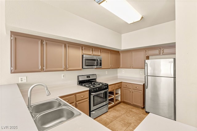 4830 Grey Wolf Ln Unit 104, Las Vegas, NV 89149 - kitchen featuring stainless steel appliances, a sink, light countertops, and light tile patterned floors