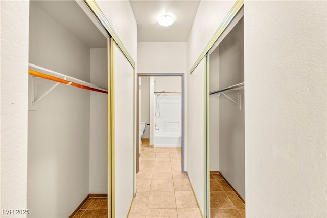4830 Grey Wolf Ln Unit 104, Las Vegas, NV 89149 - walk in closet featuring light tile patterned flooring