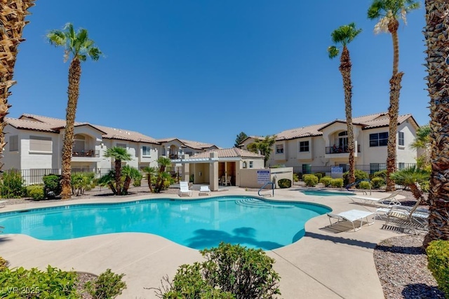 4830 Grey Wolf Ln Unit 104, Las Vegas, NV 89149 - community pool with a patio area, fence, a community hot tub, and a residential view