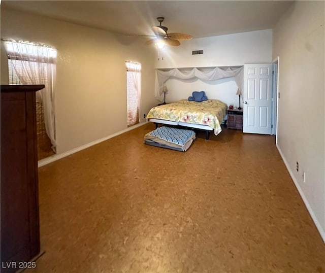 bedroom featuring baseboards and a ceiling fan