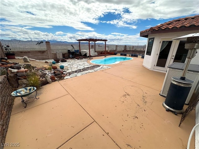 view of swimming pool with a patio, a fenced backyard, and a pergola
