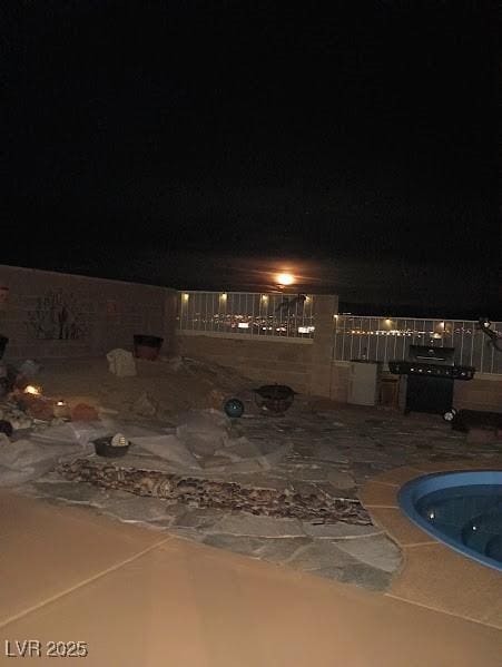 2822 La Palma Dr, Laughlin, NV 89029 - patio at night featuring a swimming pool and a patio