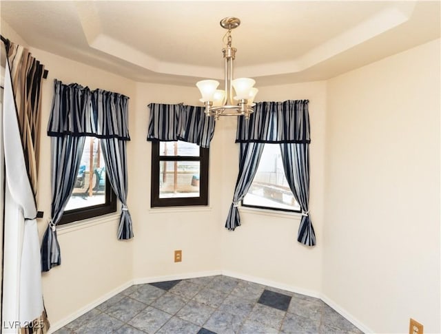 2822 La Palma Dr, Laughlin, NV 89029 - empty room with a raised ceiling, a chandelier, and baseboards