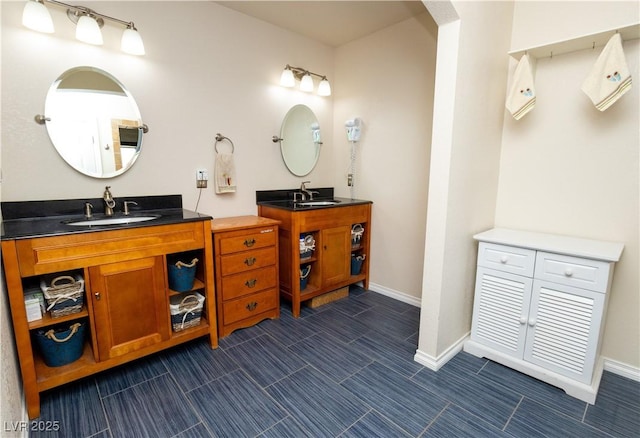 2822 La Palma Dr, Laughlin, NV 89029 - full bathroom with two vanities and baseboards