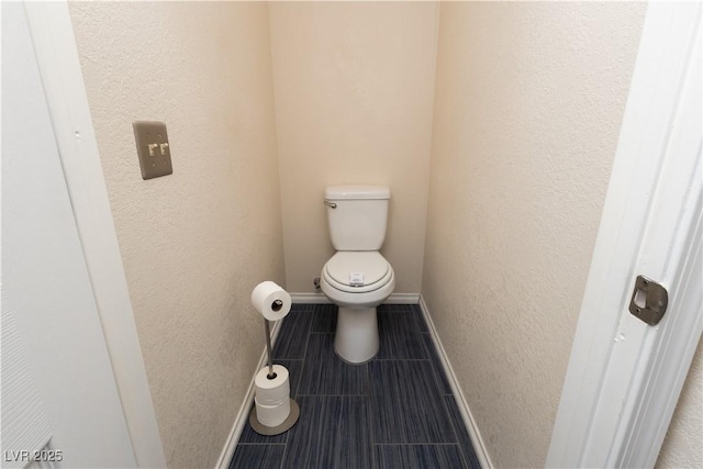 2822 La Palma Dr, Laughlin, NV 89029 - bathroom featuring toilet, tile patterned flooring, and baseboards