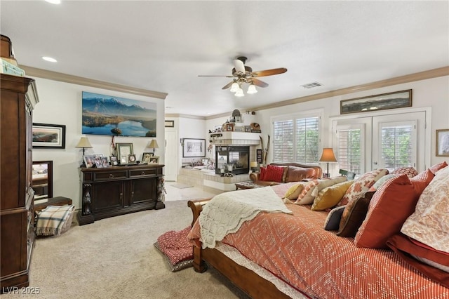 7301 Heggie Ave, Las Vegas, NV 89131 - carpeted bedroom with crown molding, a tiled fireplace, access to outside, recessed lighting, and a ceiling fan