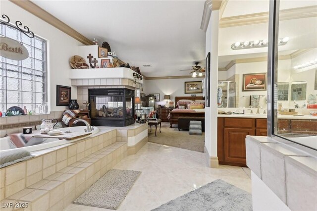 7301 Heggie Ave, Las Vegas, NV 89131 - full bath with ornamental molding, a ceiling fan, a fireplace, a bath, and a stall shower