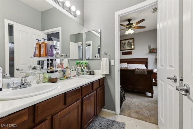 7301 Heggie Ave, Las Vegas, NV 89131 - bathroom with connected bathroom, a ceiling fan, and double vanity
