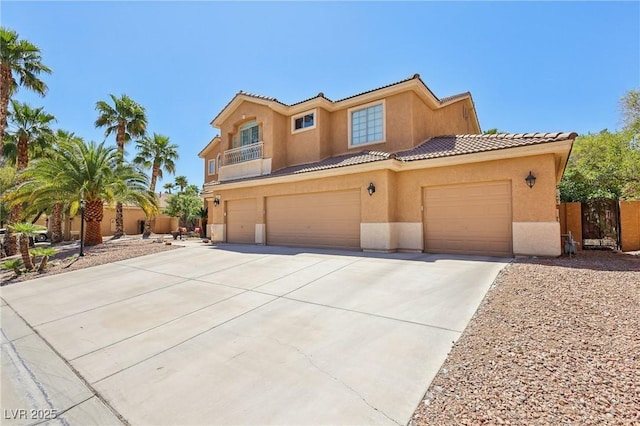 7301 Heggie Ave, Las Vegas, NV 89131 - mediterranean / spanish home featuring driveway, stucco siding, a tile roof, and fence