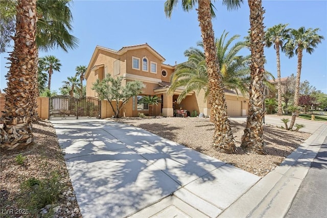 7301 Heggie Ave, Las Vegas, NV 89131 - mediterranean / spanish-style house with driveway, stucco siding, and a gate
