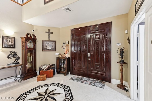 7301 Heggie Ave, Las Vegas, NV 89131 - foyer entrance featuring light tile patterned floors and baseboards