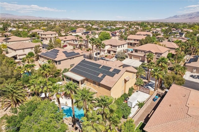 7301 Heggie Ave, Las Vegas, NV 89131 - aerial view of residential area with a mountainous background and a pool area