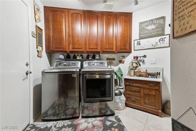 7301 Heggie Ave, Las Vegas, NV 89131 - washroom with cabinet space, independent washer and dryer, and light tile patterned floors