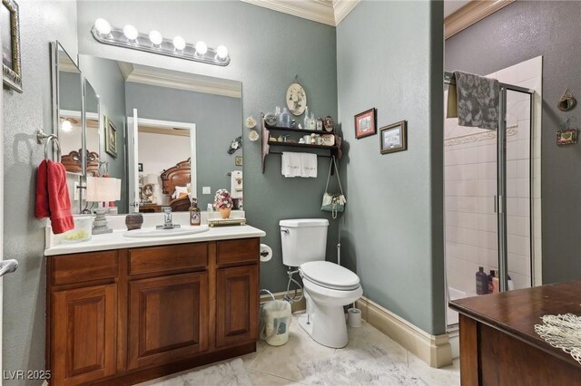 7301 Heggie Ave, Las Vegas, NV 89131 - ensuite bathroom with crown molding, a stall shower, toilet, vanity, and tile patterned flooring