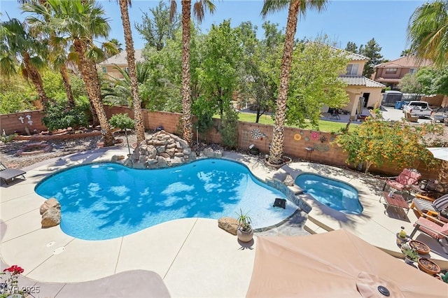 7301 Heggie Ave, Las Vegas, NV 89131 - view of swimming pool with a patio, a fenced backyard, and a pool with connected hot tub