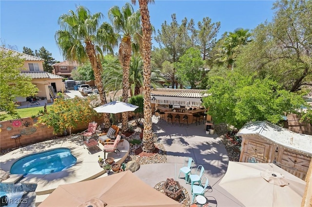 7301 Heggie Ave, Las Vegas, NV 89131 - view of patio featuring an outdoor living space with a fire pit and outdoor dining space