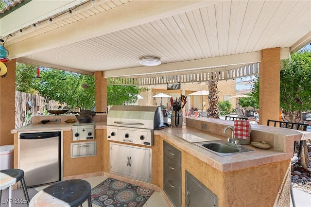7301 Heggie Ave, Las Vegas, NV 89131 - view of patio / terrace with a grill, a sink, area for grilling, and fence