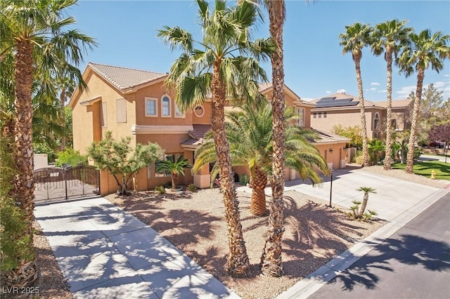 7301 Heggie Ave, Las Vegas, NV 89131 - mediterranean / spanish-style house featuring concrete driveway, stucco siding, a gate, a garage, and a tile roof