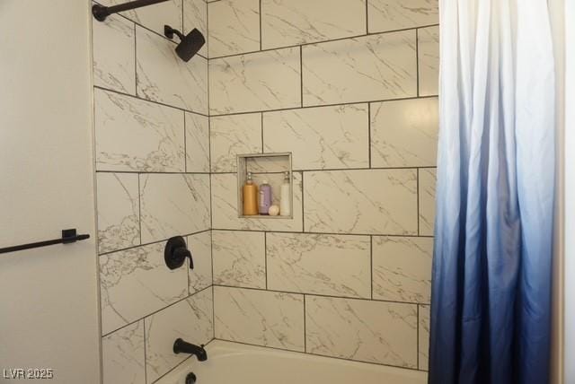 bathroom featuring shower / bathtub combination with curtain