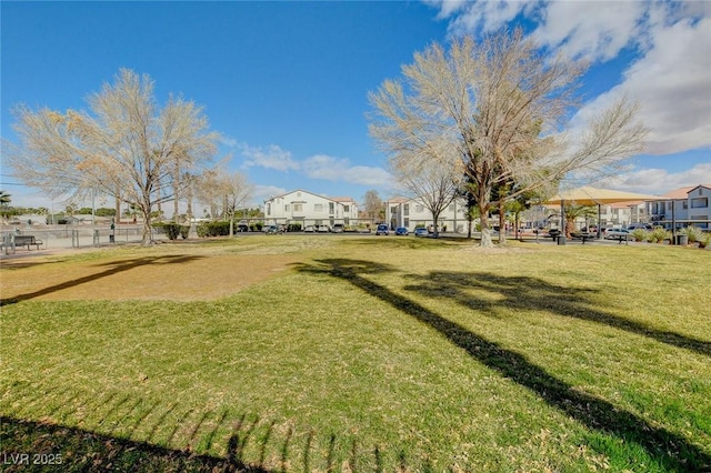 surrounding community featuring a residential view and a lawn
