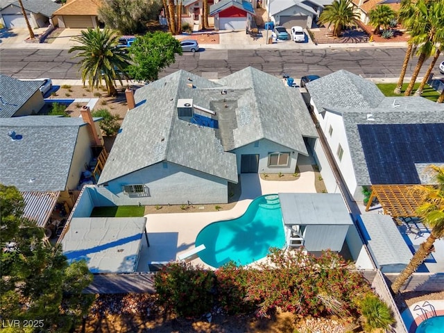 aerial perspective of suburban area with a pool