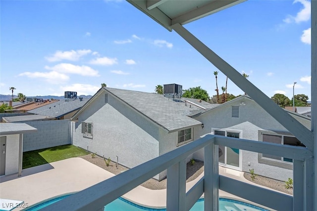 swimming pool with a patio area and fence