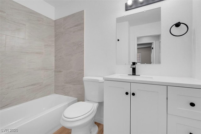 full bath featuring toilet, vanity, and wood finished floors