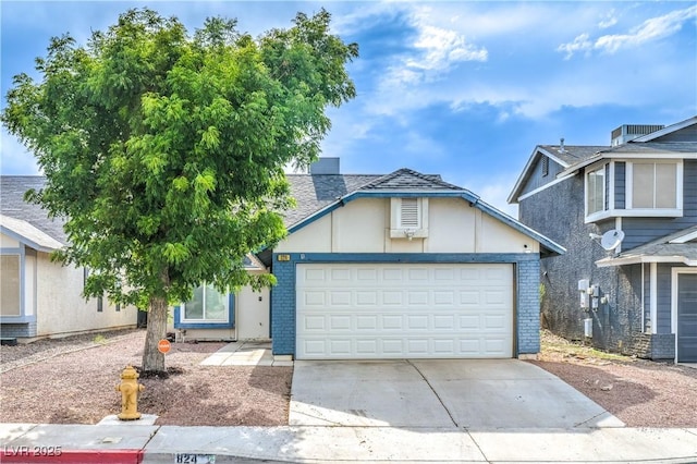 824 Schooner Dr, Henderson, NV 89015 - view of front facade with driveway, a garage, and brick siding