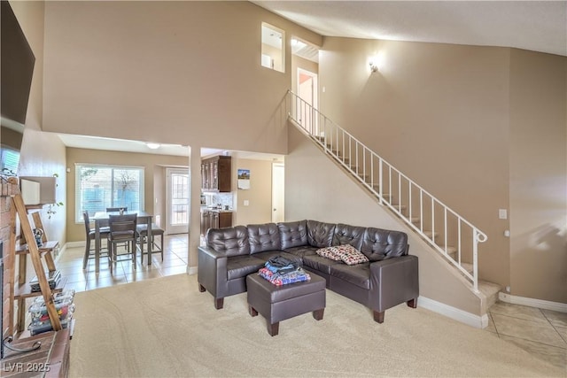 824 Schooner Dr, Henderson, NV 89015 - living area featuring high vaulted ceiling, stairs, and baseboards