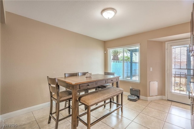 824 Schooner Dr, Henderson, NV 89015 - dining area with baseboards and light tile patterned floors