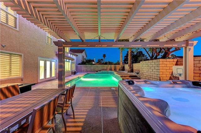 view of swimming pool featuring a hot tub, a fenced backyard, a pergola, and a patio