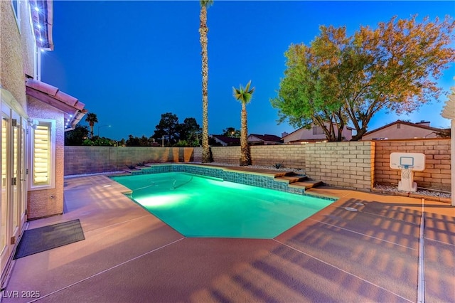 view of swimming pool featuring a fenced backyard and a patio