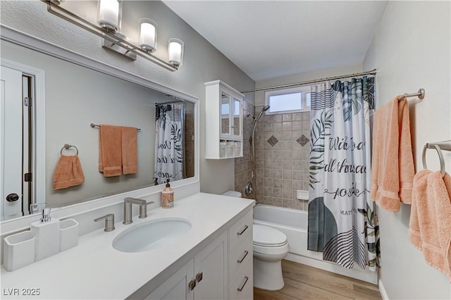 full bathroom with toilet, shower / tub combo, wood finished floors, and vanity