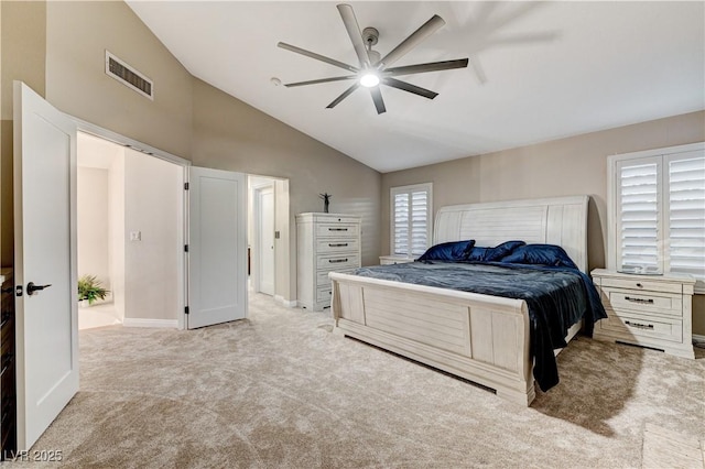 bedroom with carpet flooring, vaulted ceiling, baseboards, and a ceiling fan
