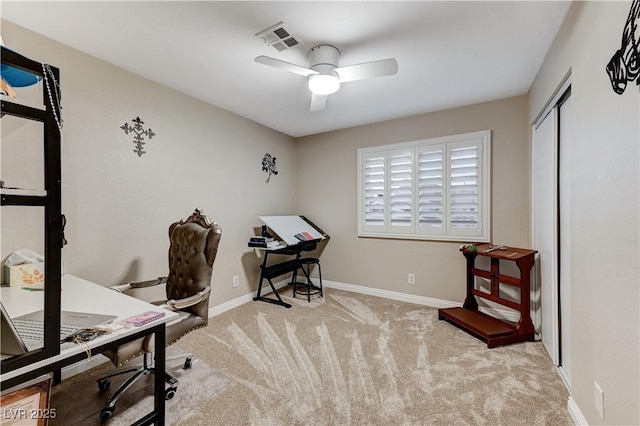 office featuring a ceiling fan, carpet floors, and baseboards