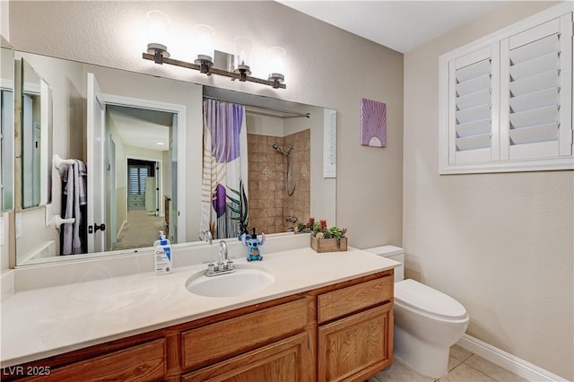 full bathroom with curtained shower, toilet, tile patterned floors, vanity, and baseboards