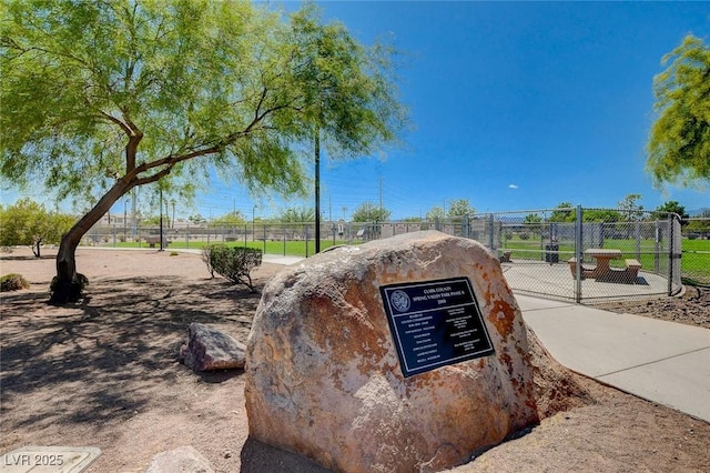 view of property's community featuring fence